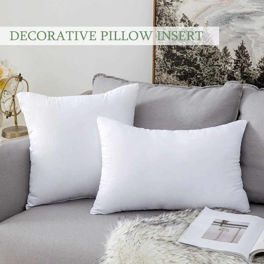 Four white square throw pillow inserts
